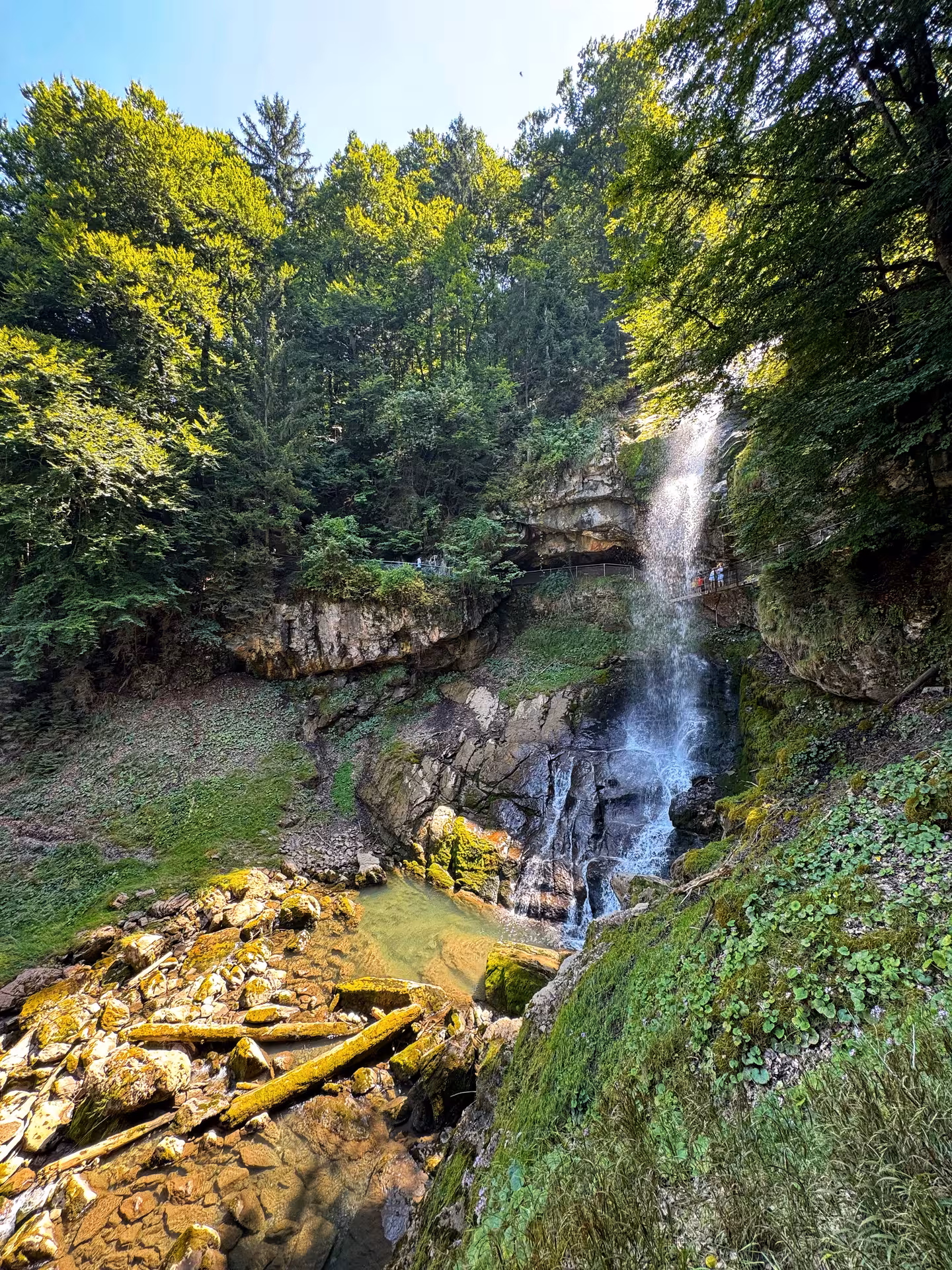 Giessbach Falls waterfall viewpoint in lush forest, scenic stop on Iseltwald & Giessbach e-bike tour