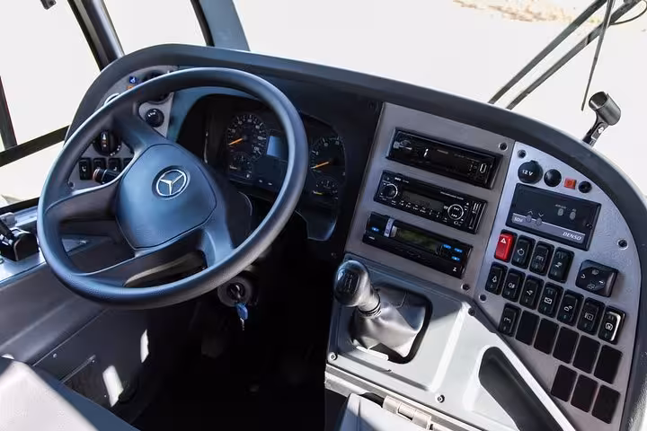 Interior of a Paraty Tours shuttle bus, showcasing modern amenities for exclusive GIG Airport to Rio hotel transfers.