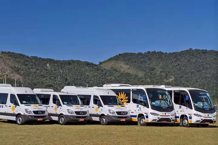 Fleet of shuttle vans ready for exclusive transport from GIG Airport to Rio de Janeiro's South area hotels.