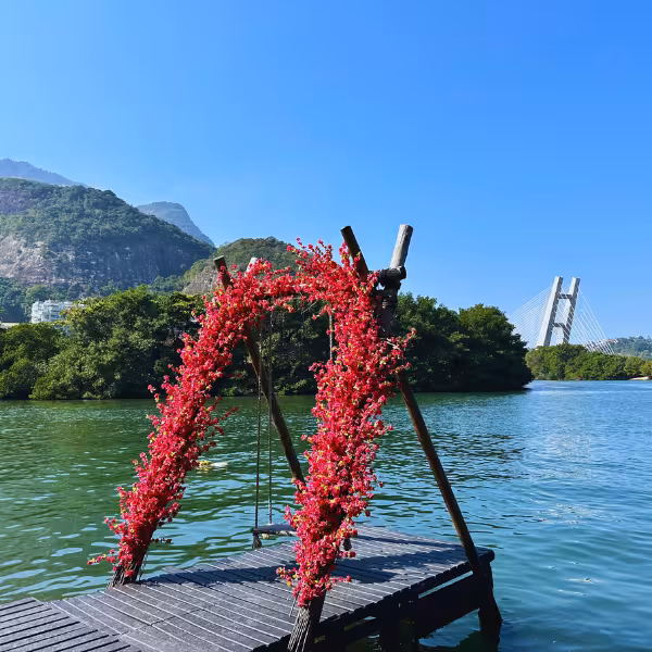 Scenic dock with floral arch on the water, ideal for a Gigóia Island boat ride in Rio's Pantanal.