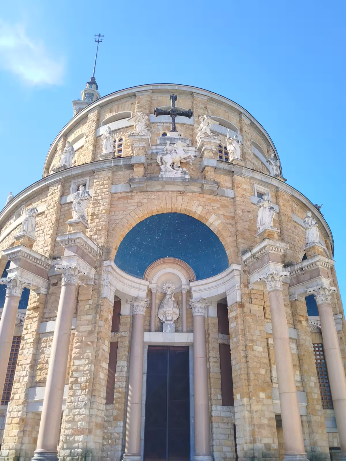 Explore historic architecture on the Gijon Cultural City Bus Tour with this stunning stone church facade.