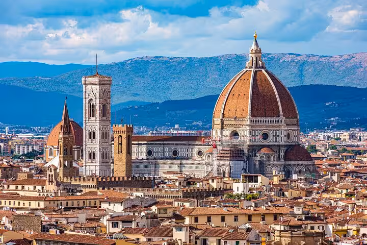 Stunning panorama of Florence featuring Giotto's Bell Tower and the Cathedral, highlighting iconic Renaissance architecture.