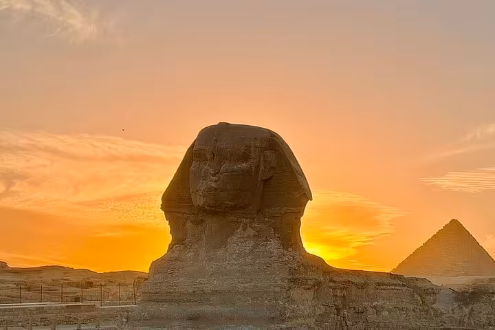 Great Sphinx and Giza Pyramid at sunset on exclusive Cairo tour with camel ride, desert bikes and Nile felucca