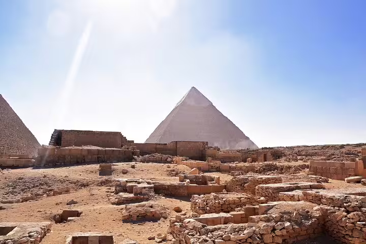 Ancient ruins near the Great Pyramid at Giza Plateau, key highlight of Cairo day tour to pyramids and museum