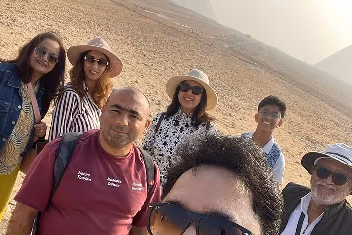 Tour group selfie in Giza desert near pyramids, exclusive Cairo camel ride, desert bike adventure and Nile felucca