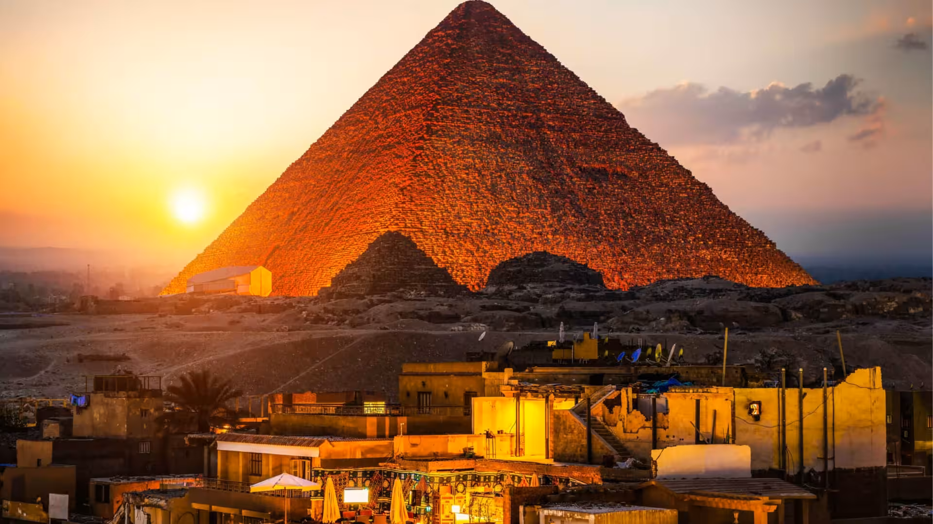 Great Pyramid of Giza lit at golden hour, iconic Cairo skyline view for Giza Sound and Light Show tour