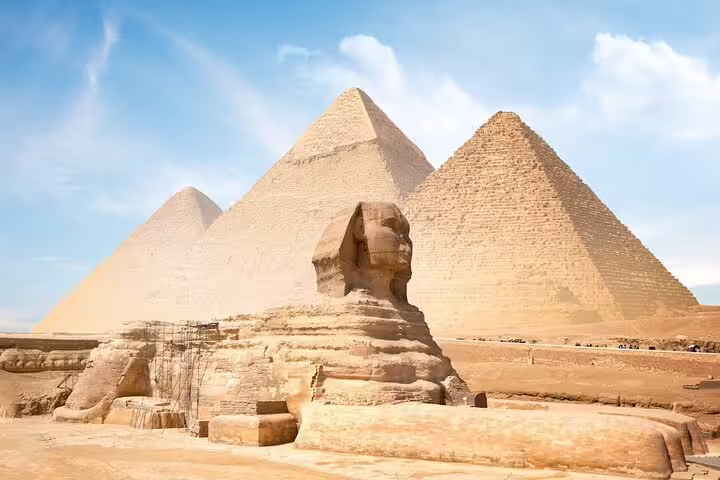 Great Sphinx and Giza Pyramids under blue sky on Cairo day tour by bus from Sharm El Sheikh with guide
