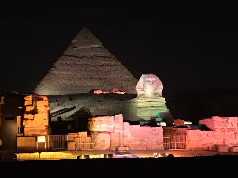 Giza Pyramids and Great Sphinx illuminated at night during Wonders of the Pharaohs Egypt tour