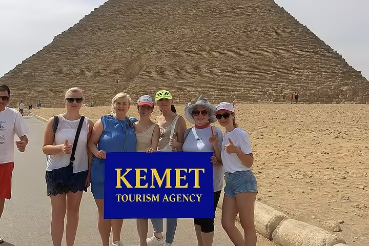 Group photo at the Great Pyramid of Giza on a half-day private guided tour, Cairo Egypt desert plateau