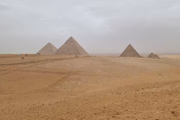 Panoramic view of the Giza Pyramids plateau in Cairo, a highlight of the Egyptian Museum day tour