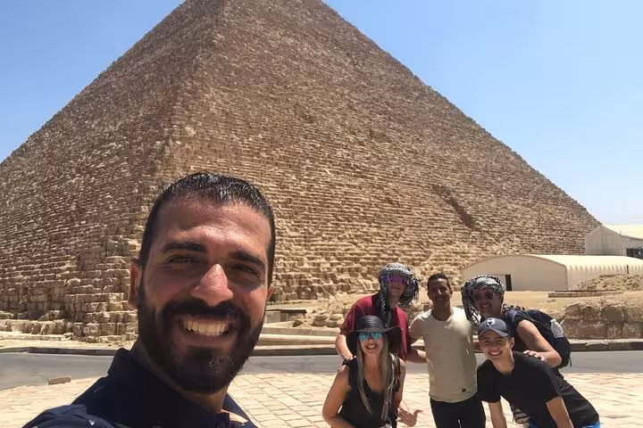 Group selfie at the Great Pyramid of Giza on a private tour with guide, Cairo day trip experience