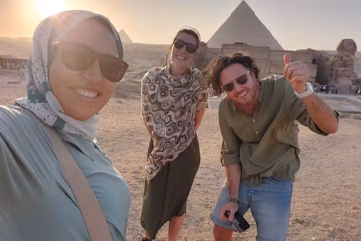 Travelers smiling at Giza Pyramids during all-inclusive guided tour to Giza, Saqqara and Memphis Egypt