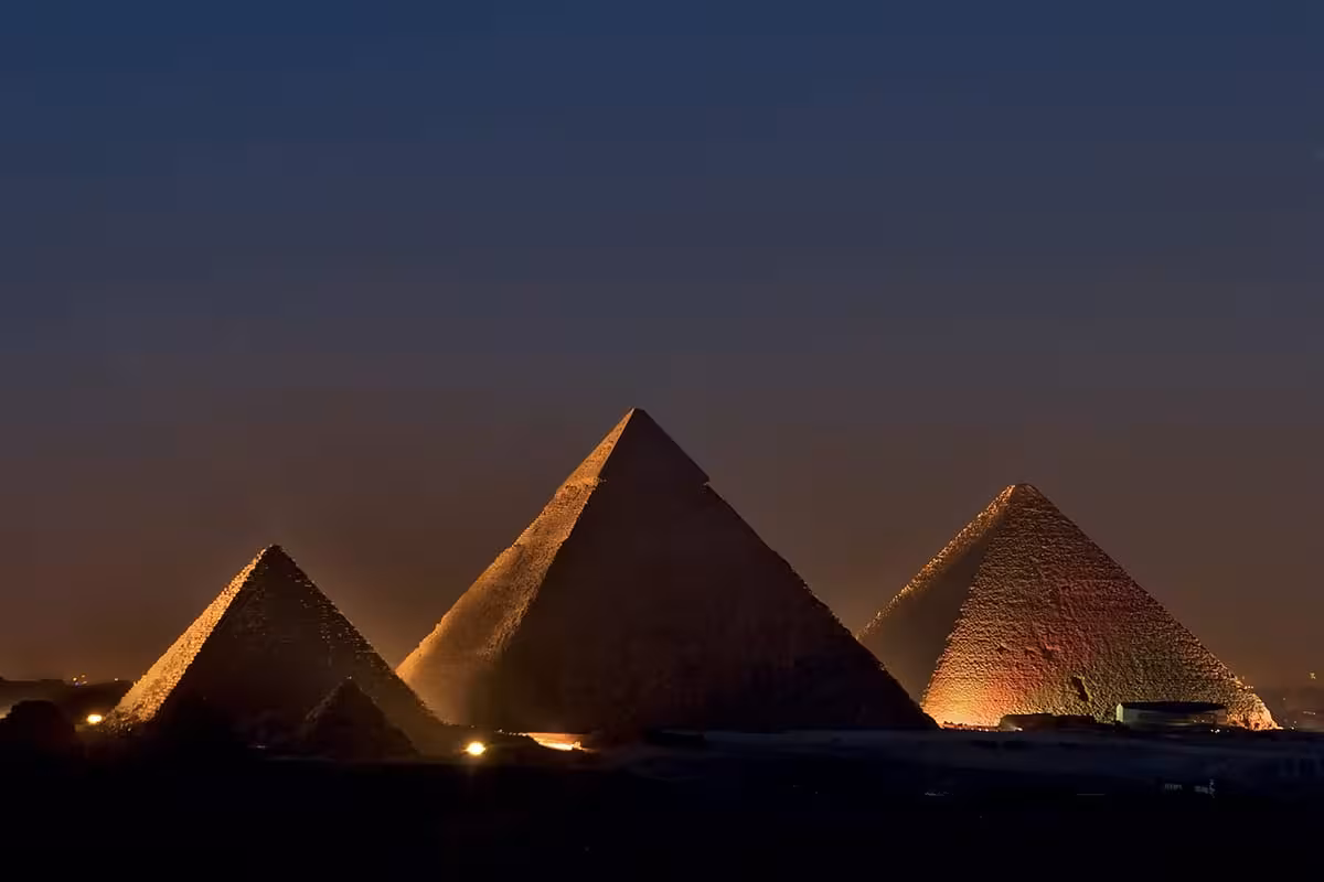 Giza Pyramids Sound and Light Show at night, illuminated pyramids in Cairo, Egypt evening tour experience