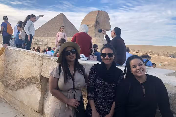 Tourists posing near the Great Sphinx and Giza Pyramid during a private full-day Cairo sightseeing tour
