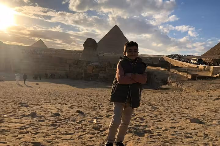 Sunset at the Giza Plateau with Sphinx and pyramids in the background on a private guided desert tour