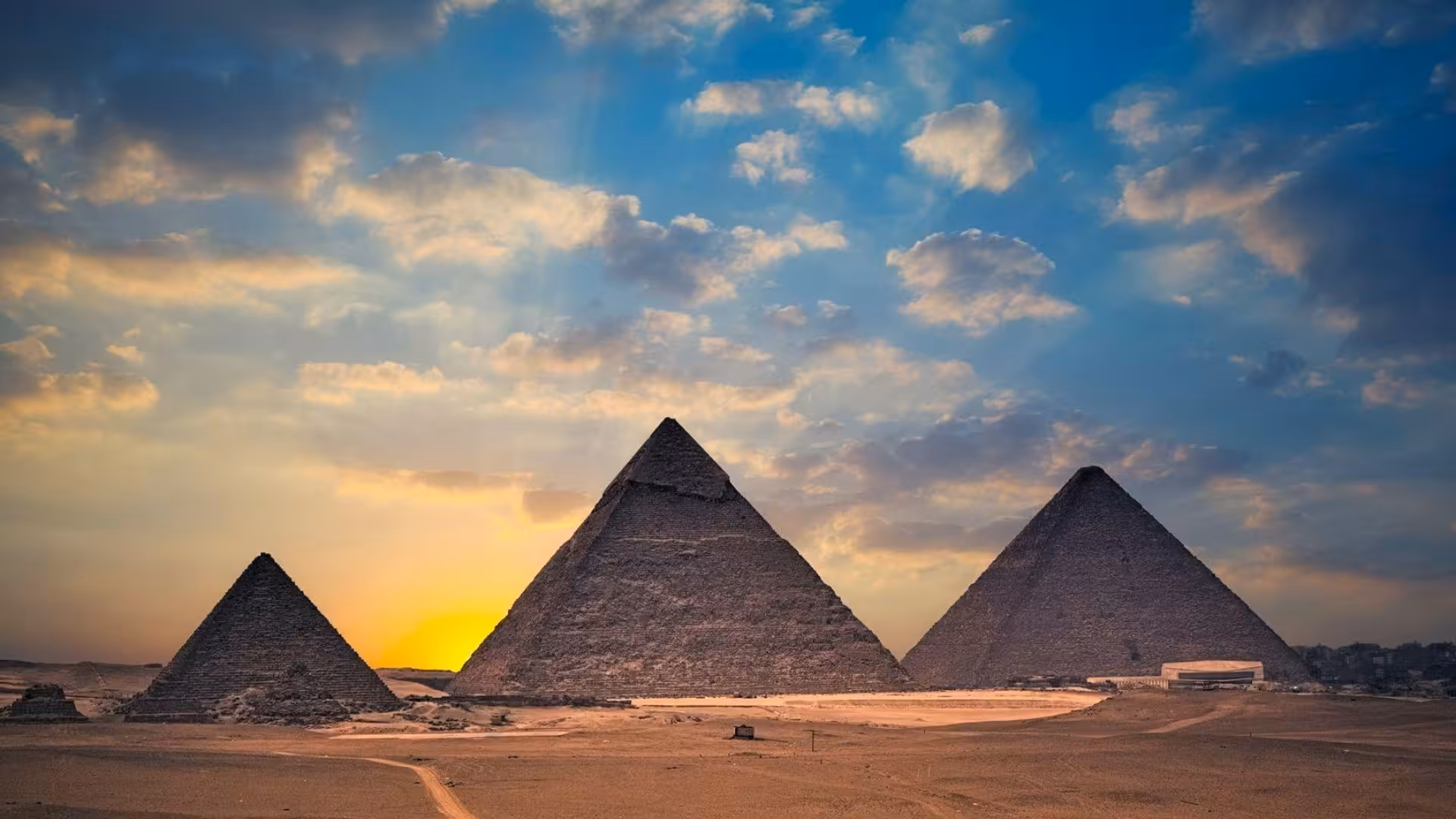 Giza Pyramids at sunset on a 1 day Cairo tour, iconic ancient Egypt landmark with desert panorama