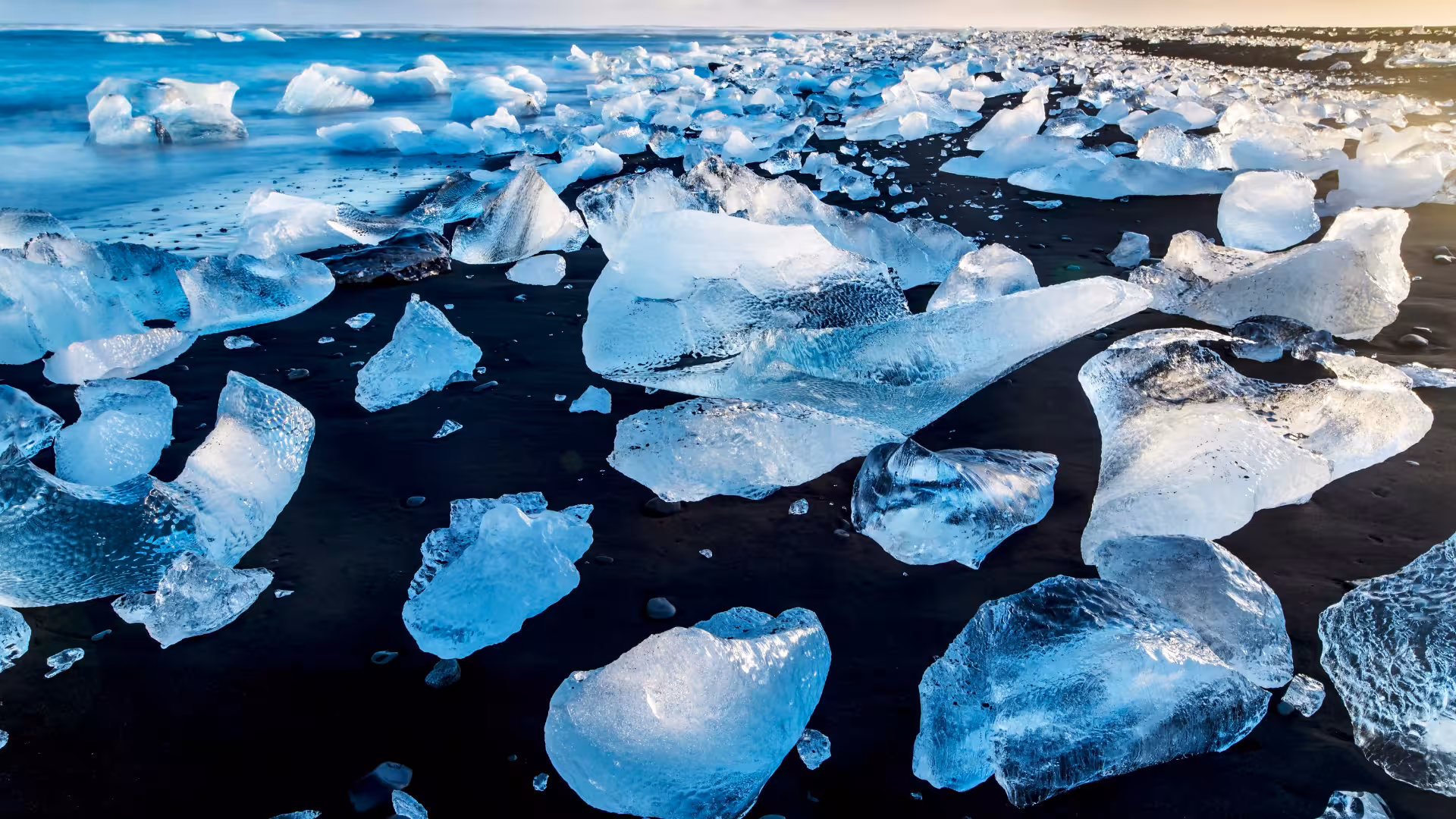 Diamond Beach ice chunks on black sand near Jökulsárlón, scenic stop on Glacier Lagoon private rally car tour