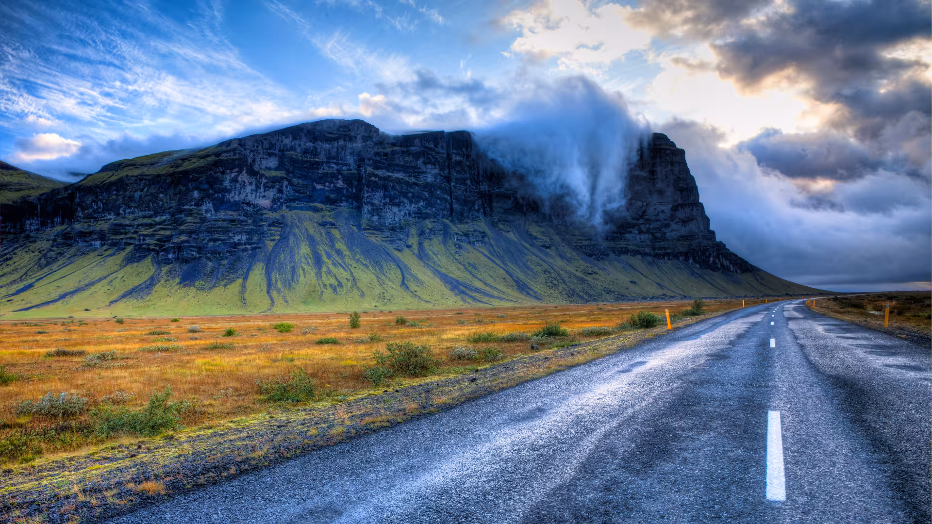 Scenic Iceland Ring Road drive with mountain cliffs, part of Glacier Lagoon private rally car adventure