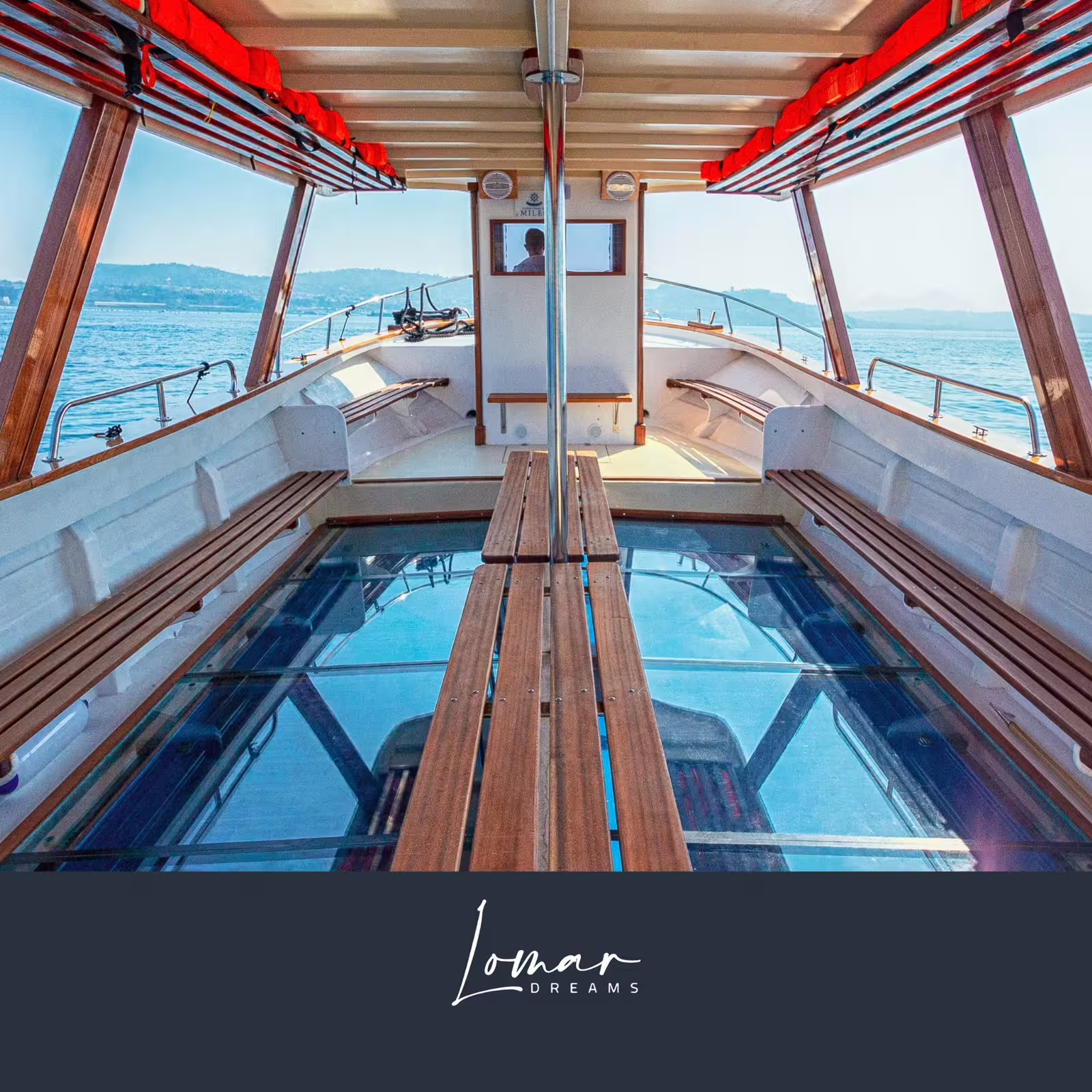 Glass-bottom boat interior for Archeoemotions Baia Sommersa mosaics tour in the Gulf of Naples, Italy