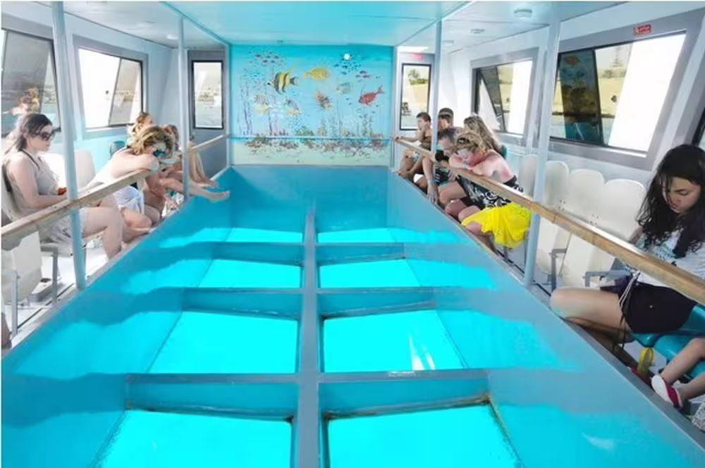 Glass-bottom boat cabin in Sharm El Sheikh with panoramic viewing deck for Red Sea coral reef sightseeing trip