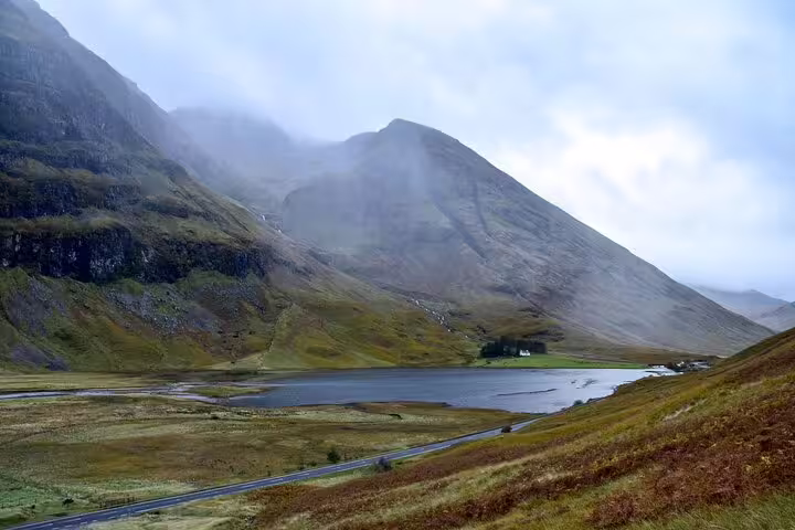 Misty Glencoe valley with loch and rugged Highland peaks, scenic stop on Glencoe and Highlands Adventure