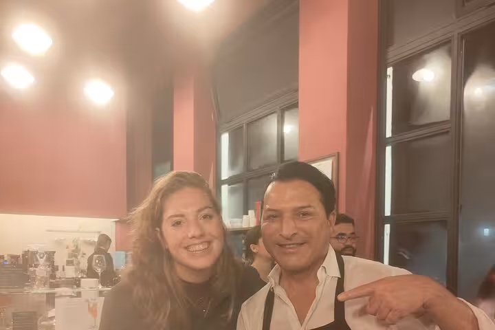 Happy participants at a gluten-free pasta course in Rome, showcasing a vibrant cooking experience with friendly atmosphere.