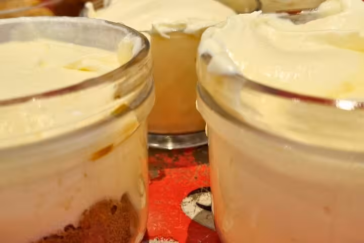 Close-up of creamy gluten-free dessert jars prepared in Roman Feast Cooking Class with Chef Christian.