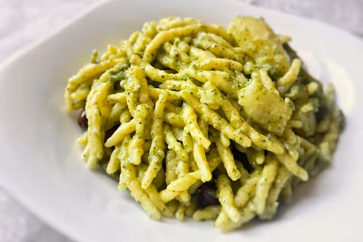 Savor gluten-free trofie pasta with creamy pesto from Chef Christian's Roman Feast Cooking Class.