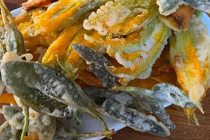 Crispy gluten-free zucchini flowers prepared in Chef Christian's Roman feast cooking class.