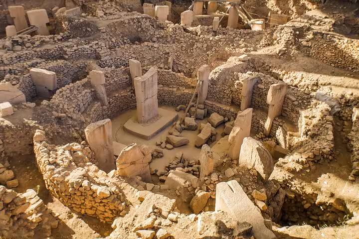 Gobekli Tepe excavation with ancient T-shaped pillars, highlight of Mount Nemrut and Gobekli Tepe tour from Istanbul