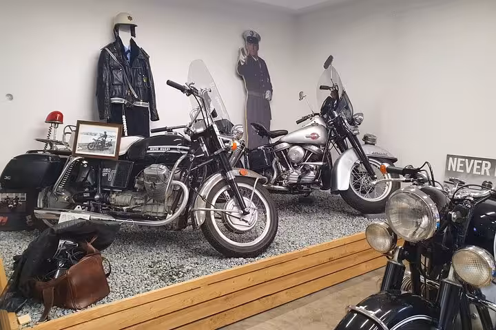 Vintage motorcycles and police memorabilia showcase at a museum in Akureyri, adding cultural depth to the Godafoss Express tour.