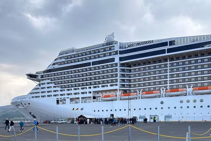 Large cruise ship docked at Akureyri port, a starting point for the Godafoss Waterfall day tour.