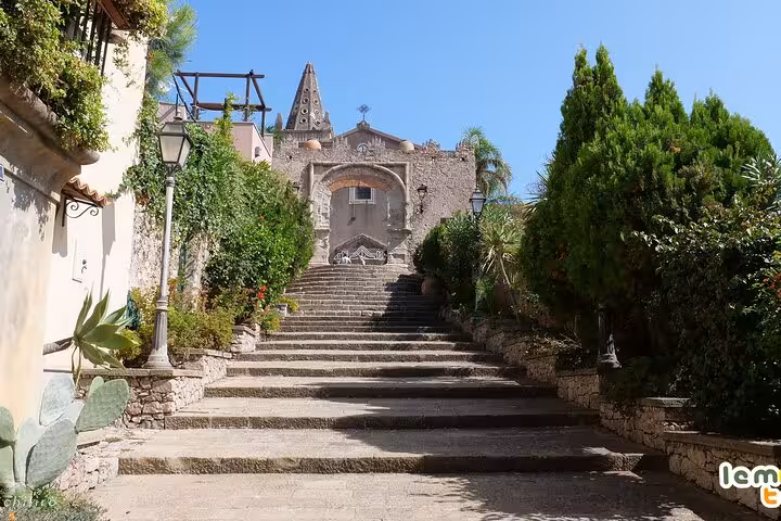 Stone steps leading to the historic church in Savoca, a key filming location for The Godfather tour in Sicily.