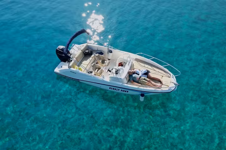 Private speedboat floating over crystal-clear Adriatic near Hvar and Paklinski Islands on Golden Horn tour