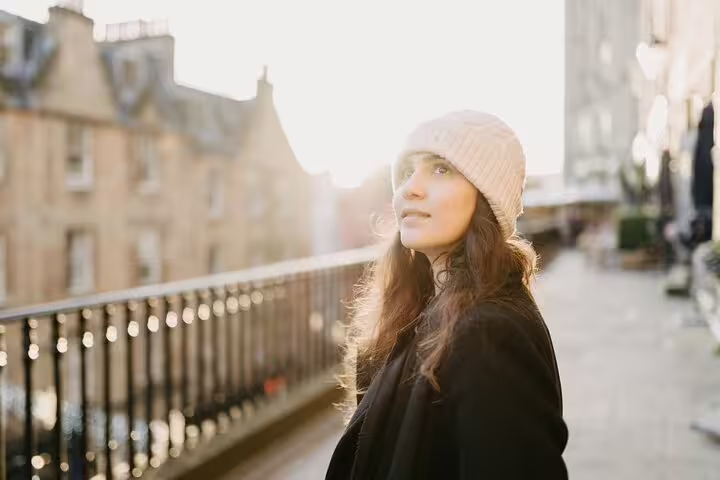 Golden-hour portrait on Edinburgh Old Town bridge during a private photoshoot with a professional photographer