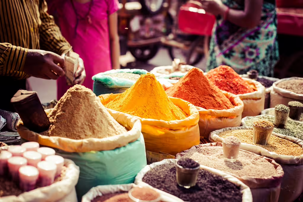 Experience vibrant spices at a bustling Jaipur market on the Classic Golden Triangle 7-day tour.