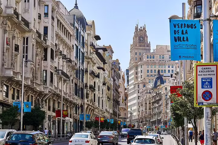 Gran Vía Madrid streetscape on a self-guided e-scavenger hunt, discovering city highlights with an interactive app