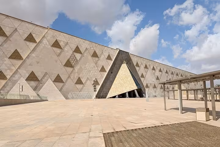Grand Egyptian Museum exterior in Cairo, modern pyramid facade on Hurghada day trip tour
