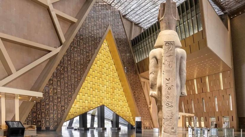 Grand Egyptian Museum Cairo interior with colossal pharaoh statue, private 4-day Cairo sightseeing tour