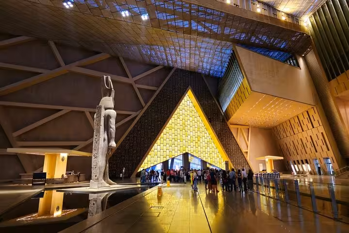 Grand Egyptian Museum entrance in Giza, modern atrium with statue, on 5-day Cairo to Luxor tour