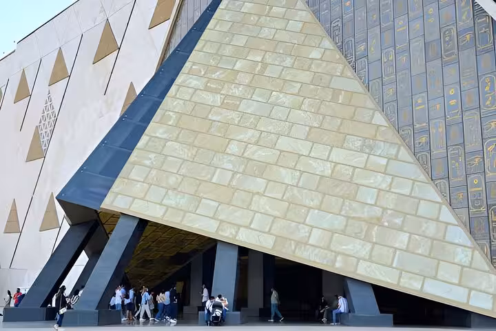 Grand Egyptian Museum Giza entrance with pyramid-shaped facade, key stop on private Giza tour and bazaar