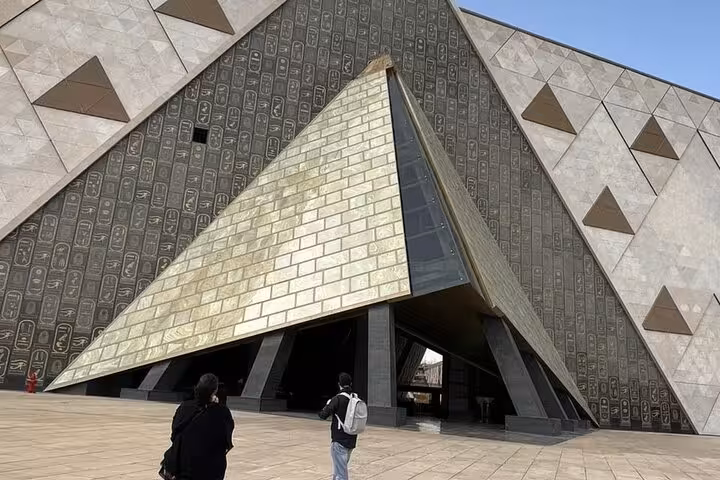 Grand Egyptian Museum entrance in Giza, modern pyramid architecture stop on private tour with pyramids, Sphinx and ATV