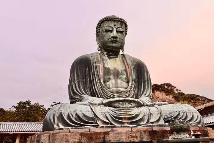 The Great Buddha statue in Kamakura at dusk, a highlight of the Tokyo to Kamakura English Guided Private Tour.