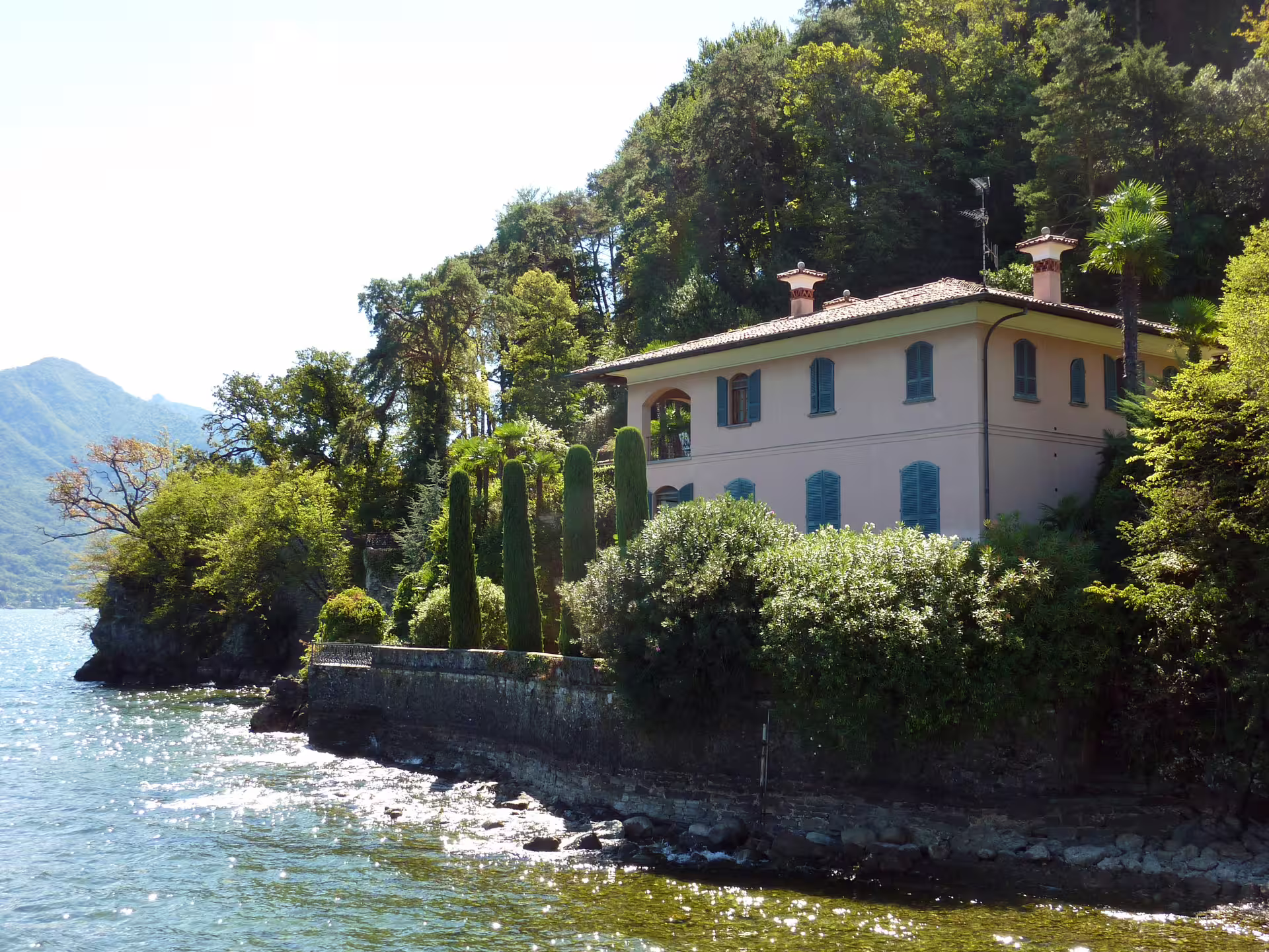 Elegant lakeside villa surrounded by lush trees on Great Lakes Tour, 8 days self drive escape through scenic Italian lakes