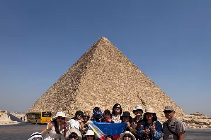 Group tour photo in front of the Great Pyramid of Giza, Egypt, exclusive pyramids and desert adventure day trip