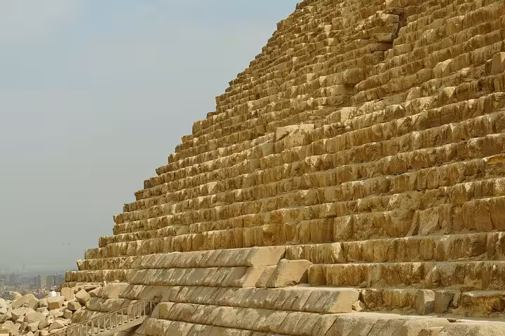 Close-up of the Great Pyramid of Giza stone blocks on Cairo day trip by bus from Sharm El Sheikh