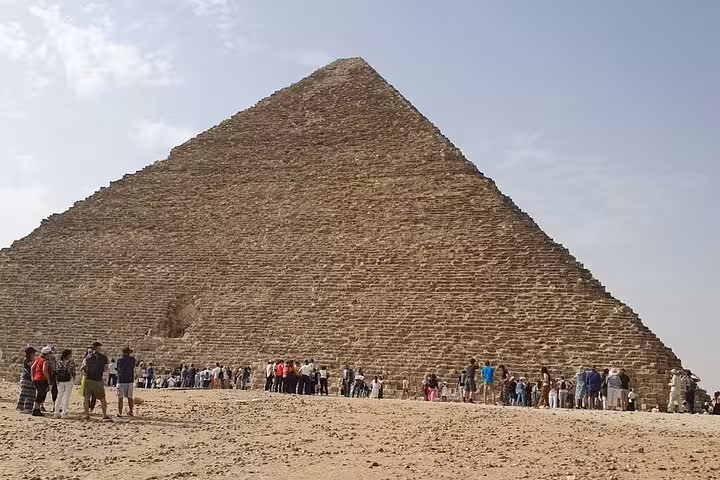 Crowds at the Great Pyramid of Khufu on the Giza Plateau, key stop on a full-day private Giza and Saqqara tour