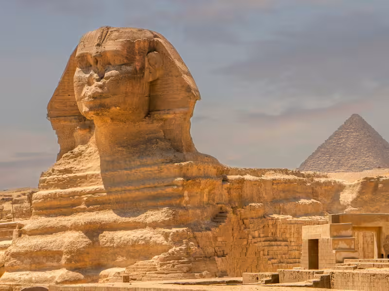 Great Sphinx of Giza with pyramid backdrop, classic Cairo excursion on Best Of Egypt 5-star Nile cruise package