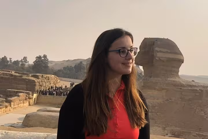 Visitor near the Great Sphinx at Giza during private tour with pyramids, Grand Egyptian Museum and optional ATV ride