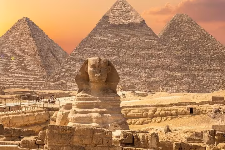 Great Sphinx and Giza Pyramids at sunset on Cairo day trip tour, visiting Pyramids, Sakkara and Memphis
